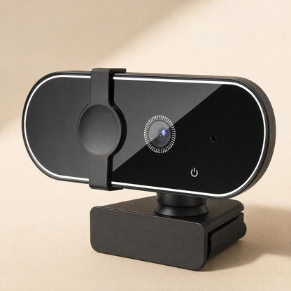 Pixelsharp – Close-up three-quarter angle of the webcam's glossy black face, ring-styled lens and power button
