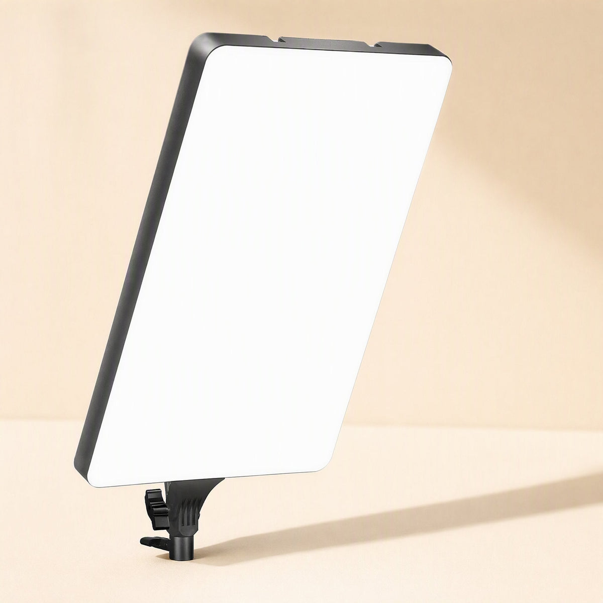 Softbeam Live Streaming Fill Light Panel tilted at an angle on a short mount against a warm beige backdrop