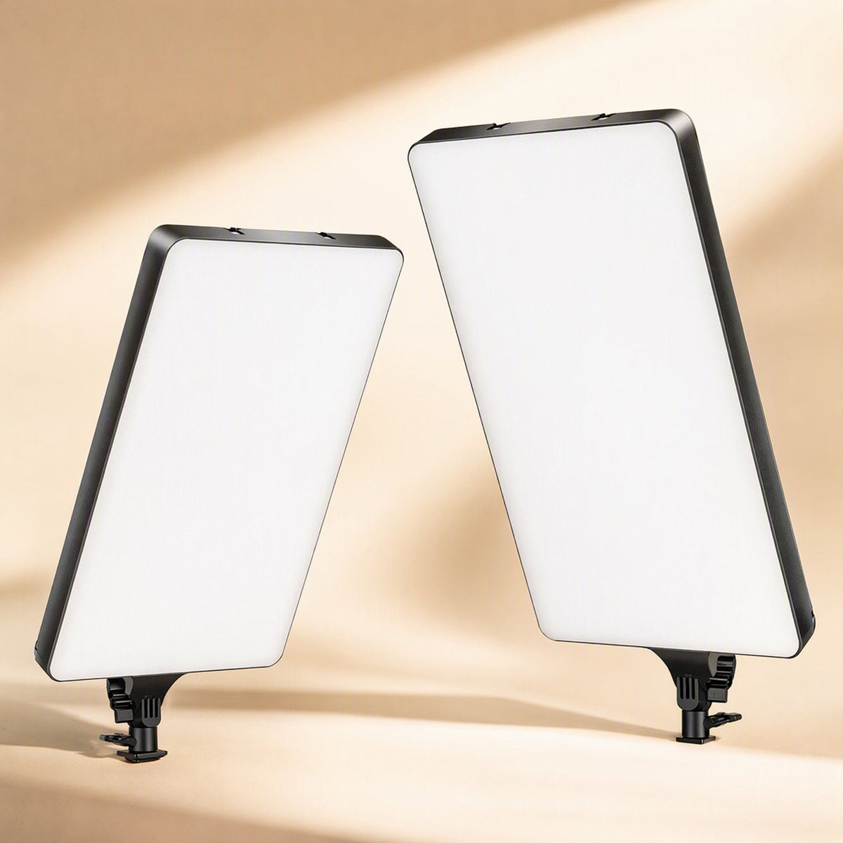 Softbeam – Two fill light panels of different sizes standing side by side on small mounts with black frames