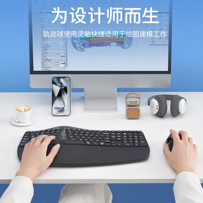 Orbital – Black trackball mouse beside an ergonomic keyboard on a desk with monitor, phone, headphones and coffee