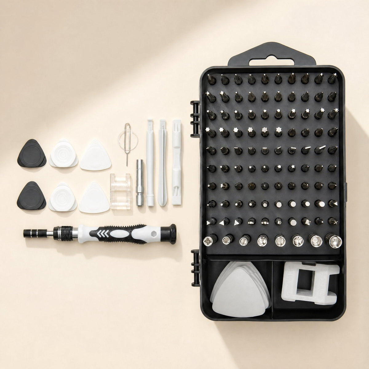 Screwcraft – Flat lay of the black case with bits, with the handle, picks, pry tools and sim ejector pin laid out beside it
