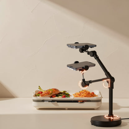 Streamstead – Arm of the phone stand shown at two heights above a plate of food, with orange arrows marking the joints