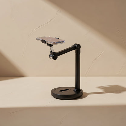 Streamstead – Side view of the black stand with a clear-cased phone held out on a bent arm over a round base