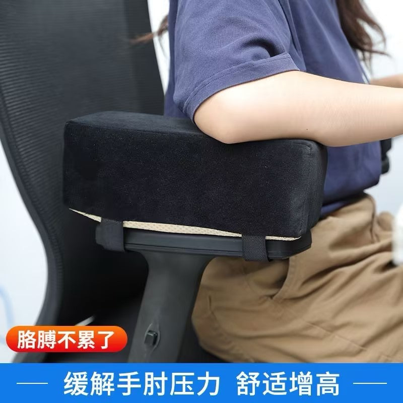 Velvopad Chair Armrest Cushion in black velvet strapped to an office chair, with a person resting their arm on it