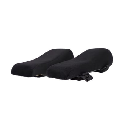 Velvopad – Pair of black armrest cushions with curved tops and a strap visible underneath, on a white background