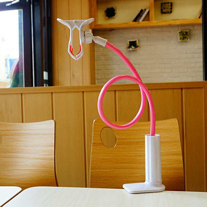 Coilrest – Pink flexible-arm stand with white clamp base and empty phone holder, clipped to a restaurant table