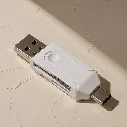 Readplug USB Type-C SD TF card reader in white, top view with USB-A and USB-C heads on a plaster surface