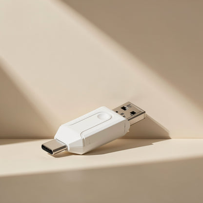 Readplug – White dual-head reader lying at an angle with the USB-C connector in front and USB-A behind, in soft light