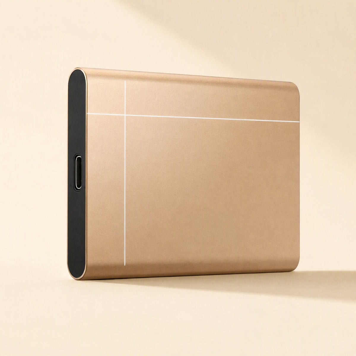 Metadrive – Gold drive standing upright, showing the USB-C port on its black end cap and thin white line design