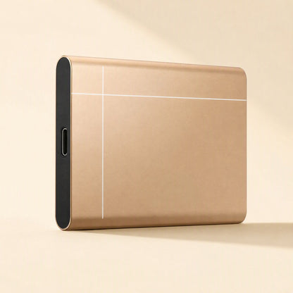 Metadrive – Gold drive standing upright, showing the USB-C port on its black end cap and thin white line design