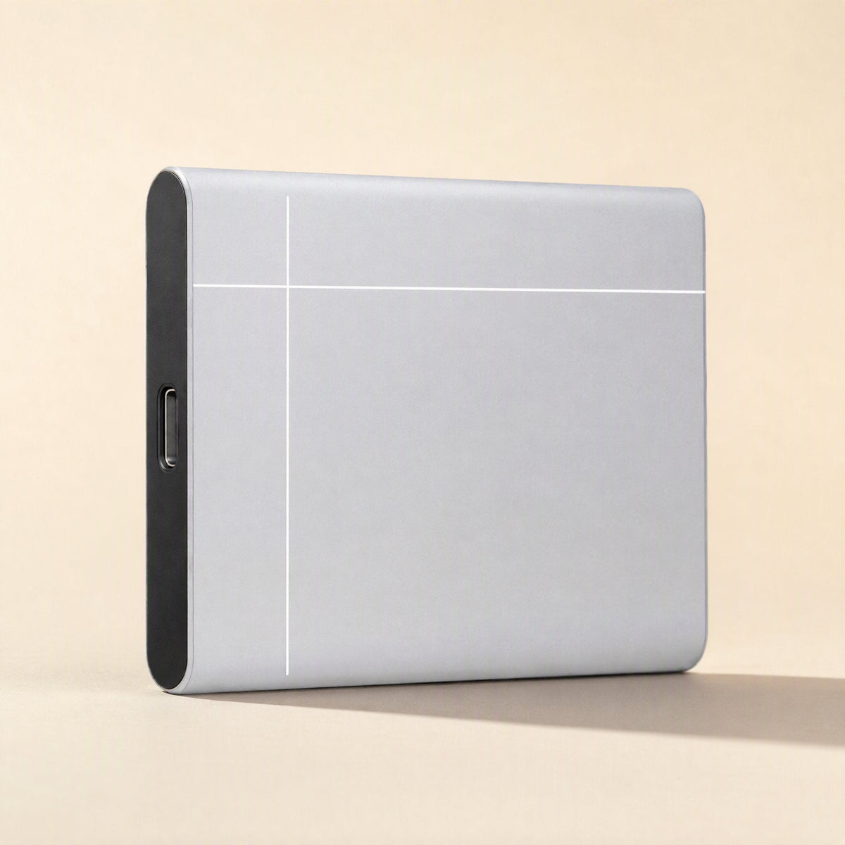 Metadrive – Silver drive standing upright, showing white line pattern and a USB-C port on the dark end cap