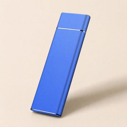 Pocketdrive – Blue slim aluminum drive tilted upright against a cream background, silver seam near the top