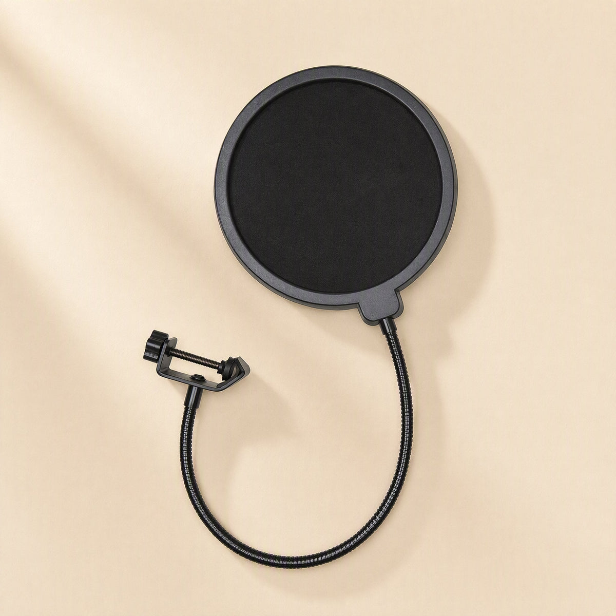 Streamveil – Top-down view of the windscreen with the gooseneck curving beneath the disc and the clamp at upper left