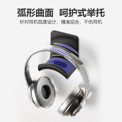 Earcradle – Curved cradle of the stand supporting transparent headphones, with blue highlights on the arch
