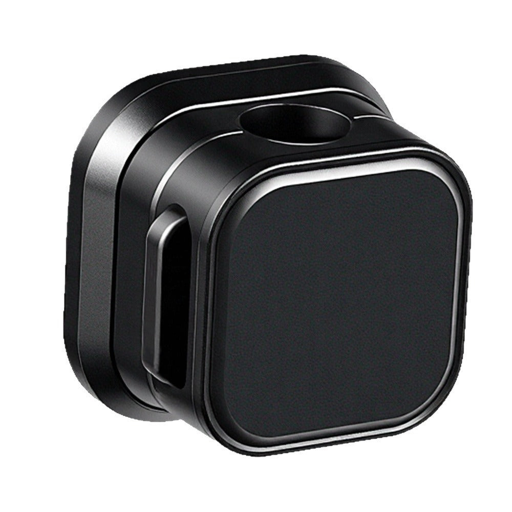 Magnetclip – Single black square cable clip at an angle, showing the cable hole on top and a side slot