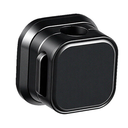 Magnetclip – Single black square cable clip at an angle, showing the cable hole on top and a side slot