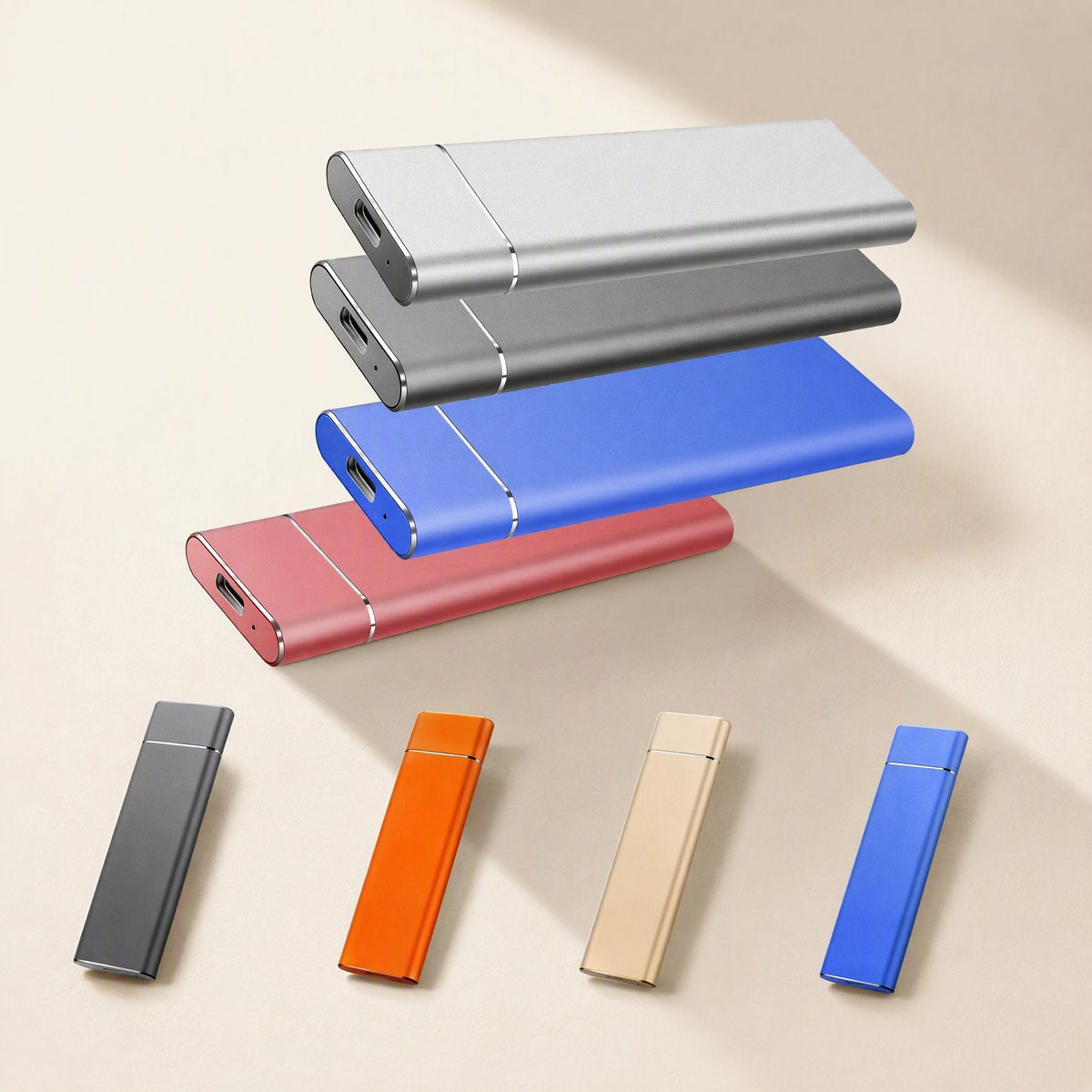 Driveglide M.2 Mobile Solid State Drive in silver, gray, blue and red floating above orange, gold and blue drives