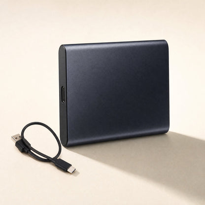 Steelsave Metal Portable Solid State Drive in dark navy beside a short USB-A to USB-C cable on a cream background
