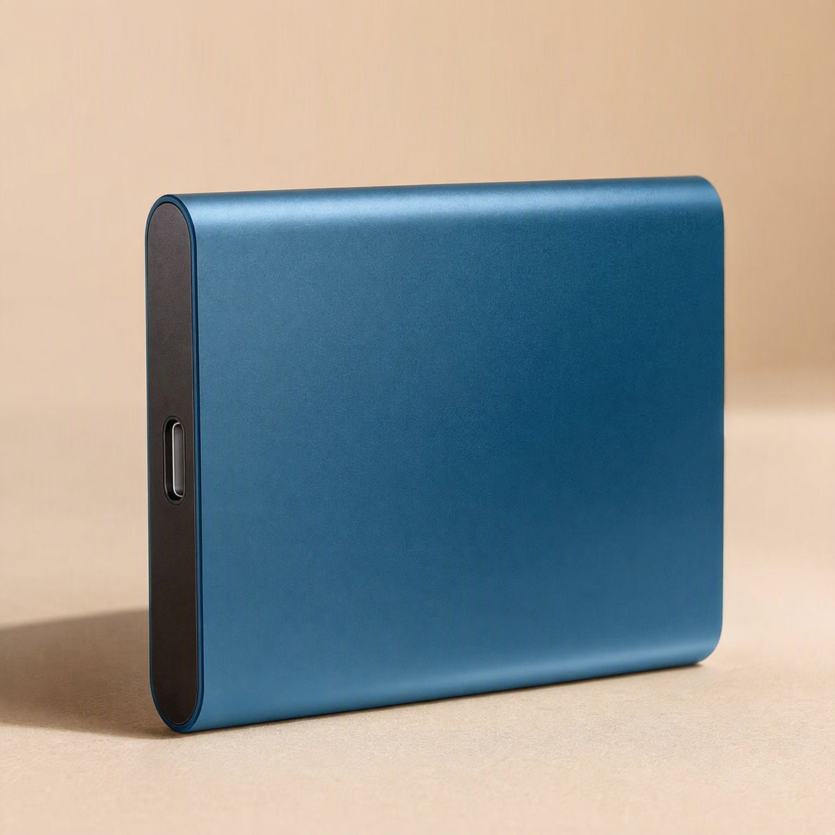 Steelsave – Blue slim metal portable drive standing upright, showing its USB-C port on the dark end panel