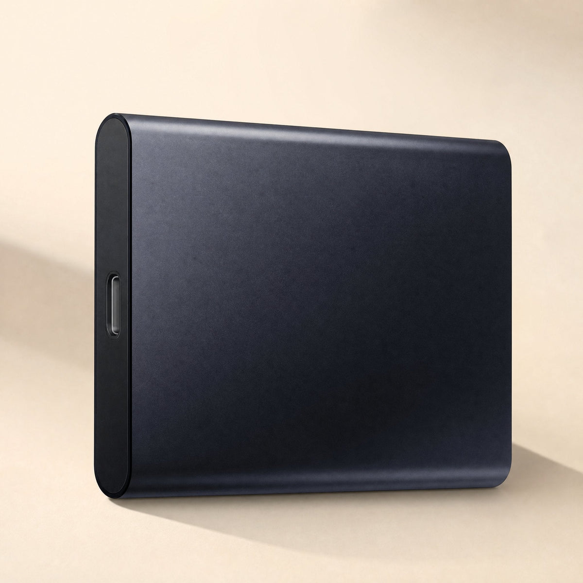 Steelsave – Close-up of a dark navy portable SSD with a matte metal finish and USB-C port on the rounded end