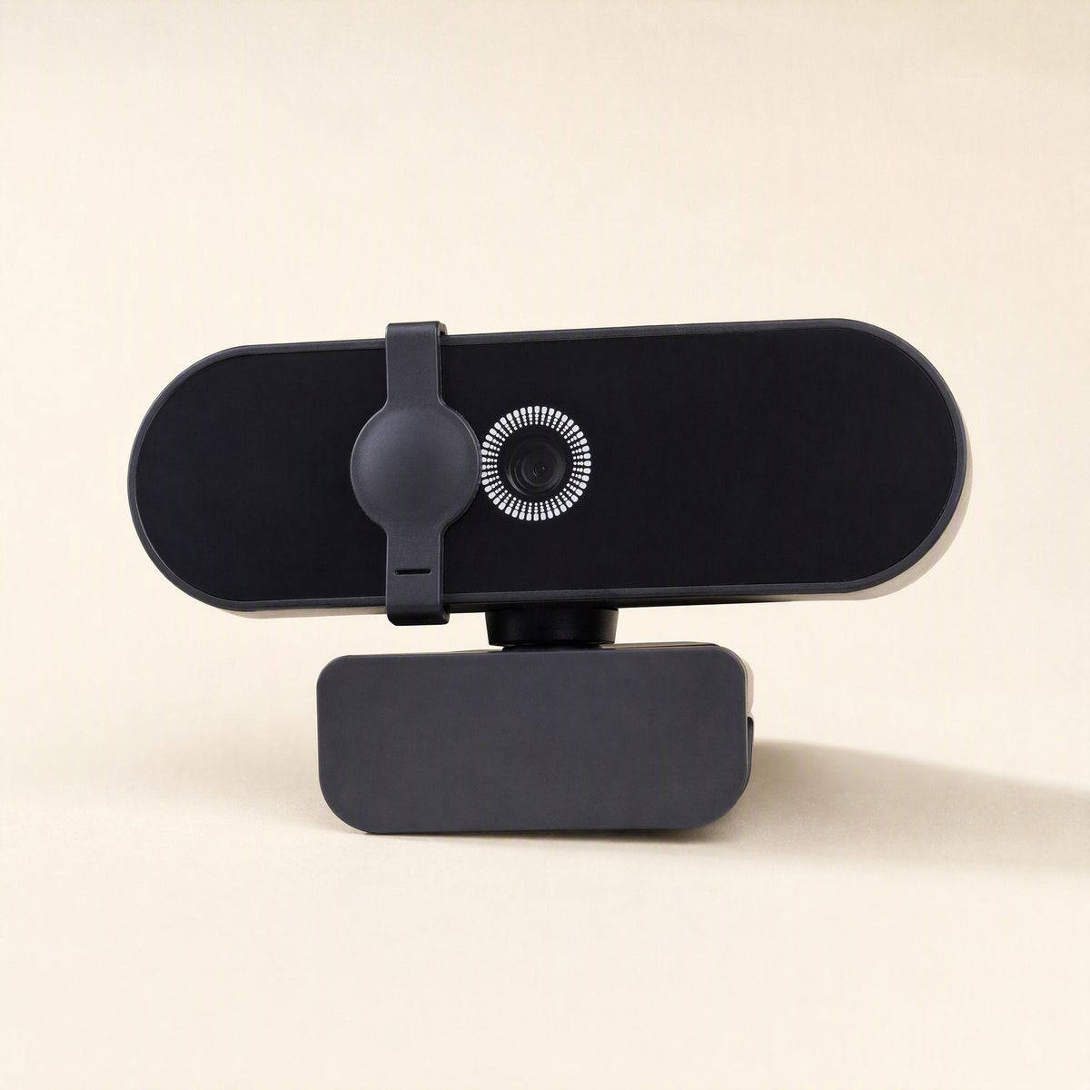 Focusview – Black webcam with a round privacy cover swung over the lens, shown from the front on its clip base