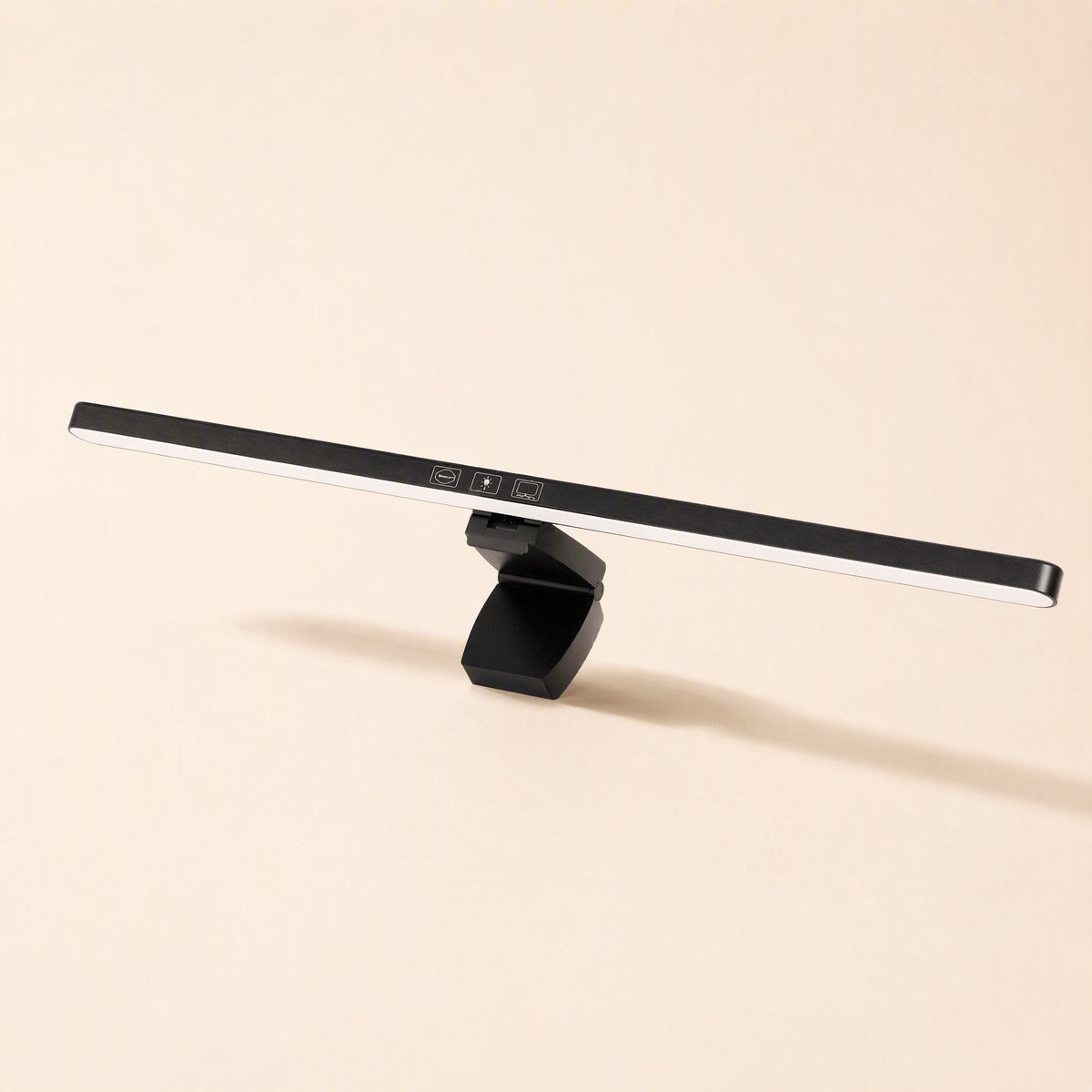 Screenlamp – Slim black monitor light bar with touch controls on the front and an angled clip, lit along its lower edge