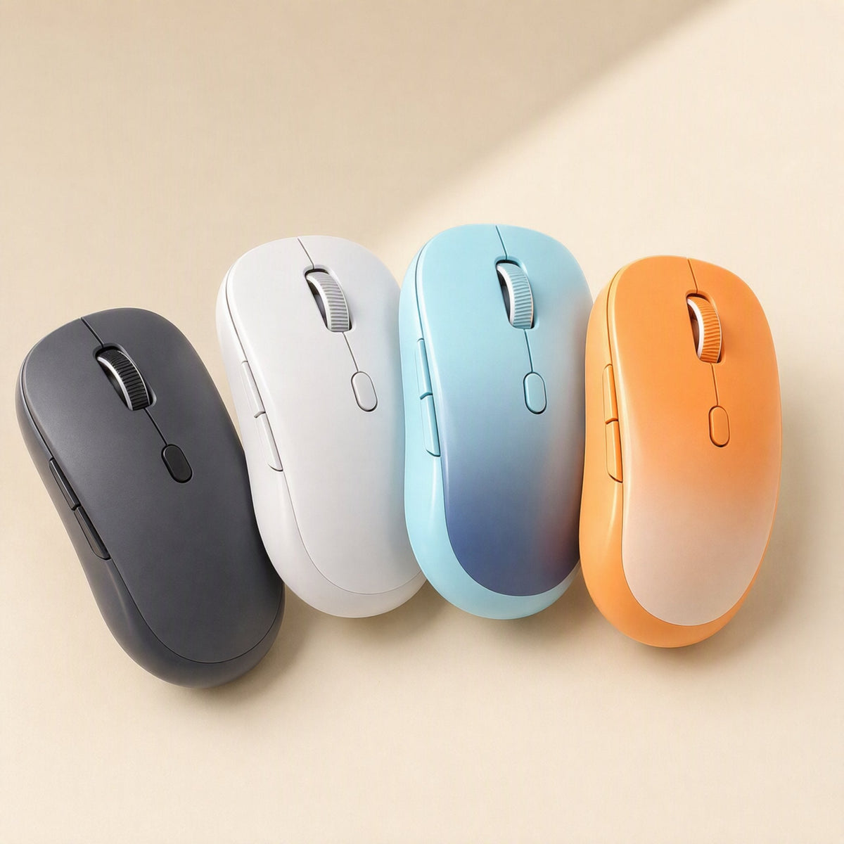 Twintrack Dual-Mode Bluetooth Optical Mouse in black, white, blue and orange lined up on a beige surface