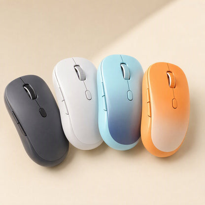 Twintrack Dual-Mode Bluetooth Optical Mouse in black, white, blue and orange lined up on a beige surface