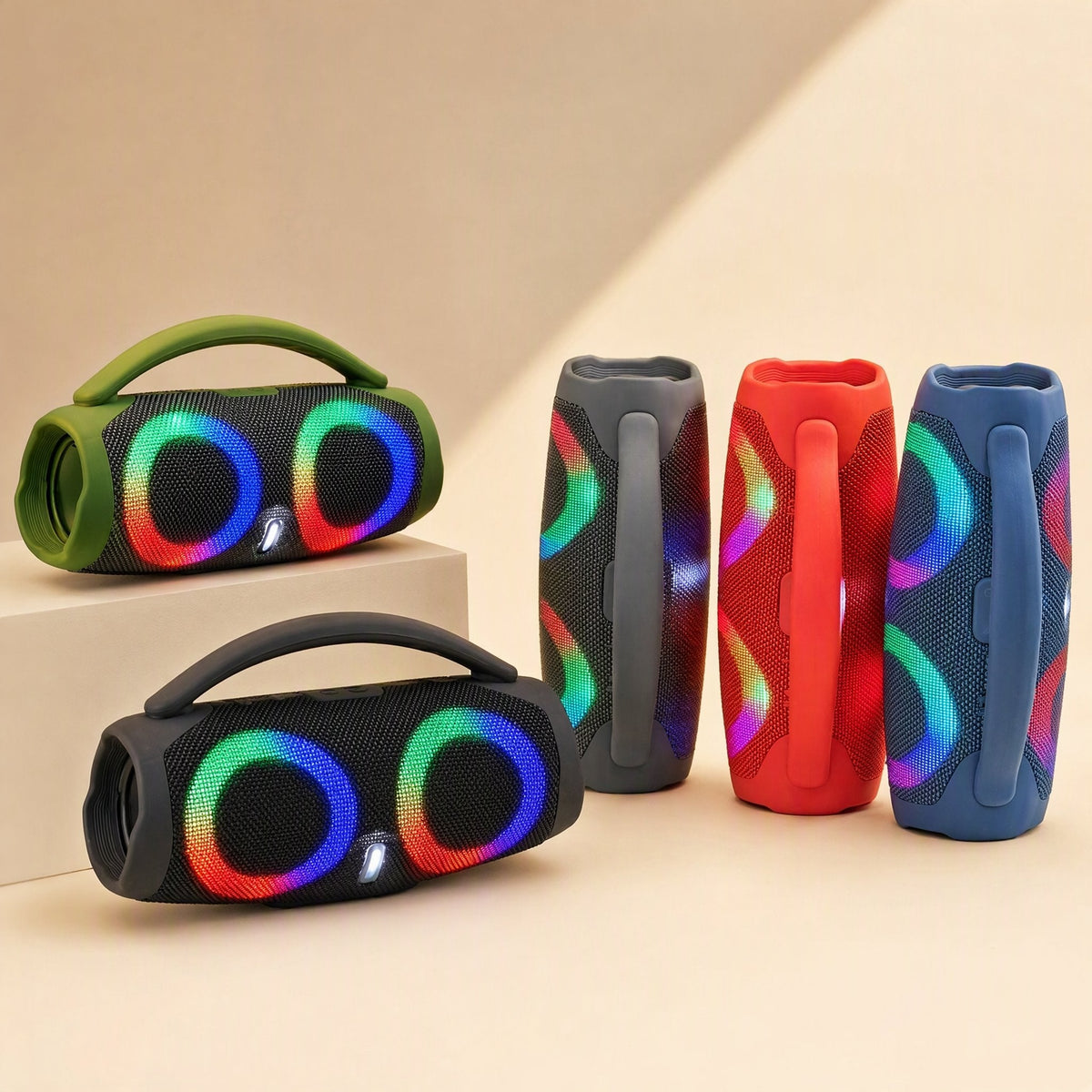 Portatune Portable Bluetooth Speaker in green and black, two lying flat, three more standing, RGB rings glowing