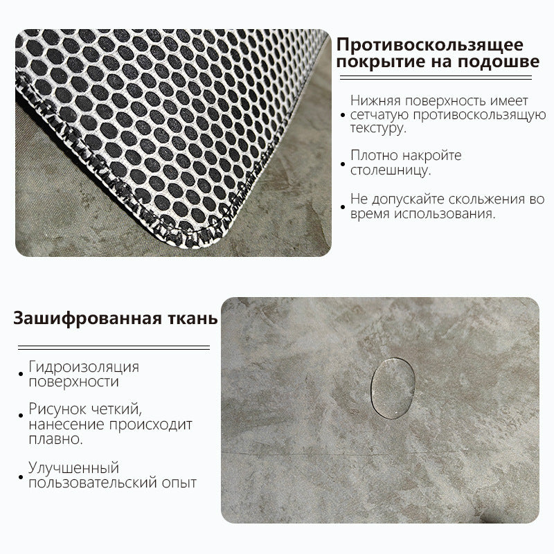 Marblet – Mouse pad underside with black honeycomb anti-slip texture and a water droplet beading on the gray surface
