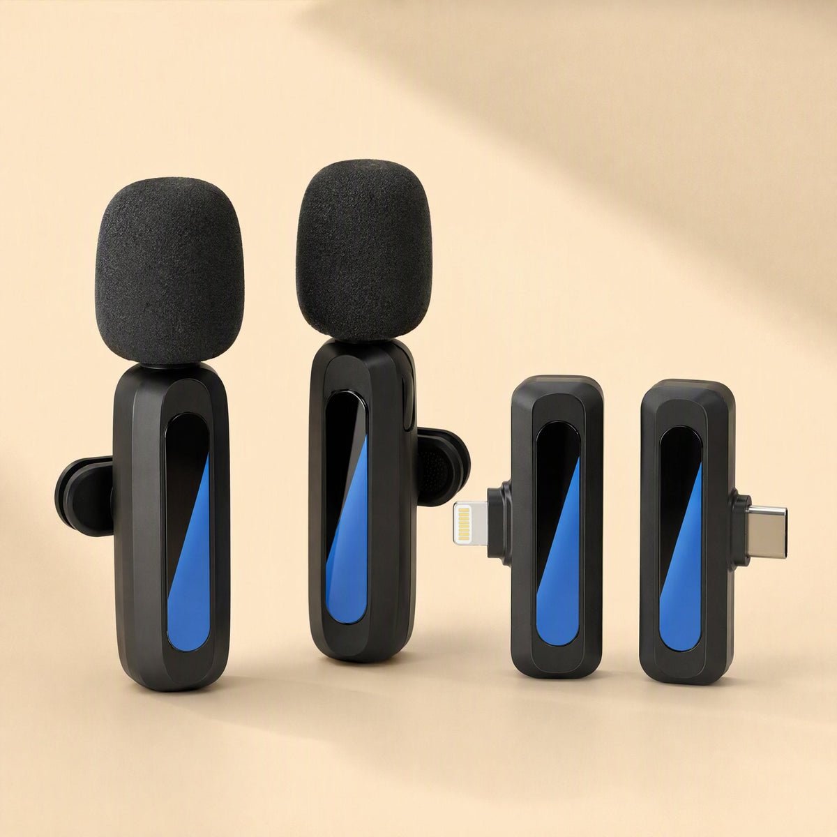 Livevoice – Two upright lavalier microphones with foam windscreens next to a Lightning receiver and a USB-C receiver
