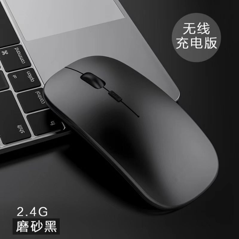 Optiglide Wireless Optical Mouse – matte black wireless mouse on a laptop keyboard, labeled 2.4G