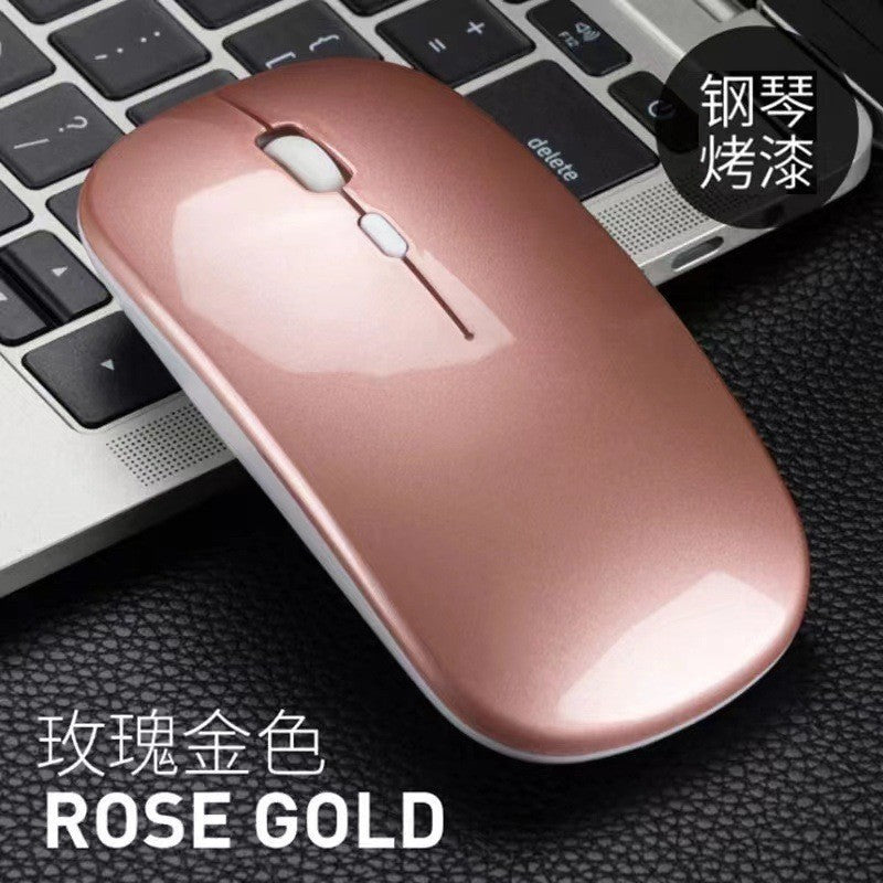Optiglide Wireless Optical Mouse – rose gold glossy wireless mouse on a laptop keyboard, labeled Rose Gold