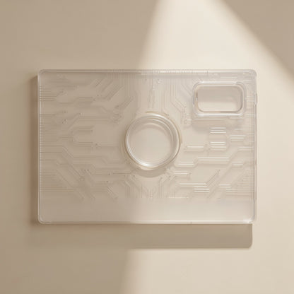 Gelguard – Close-up of a clear circuit-pattern film sheet with camera cut-out marks on a beige surface