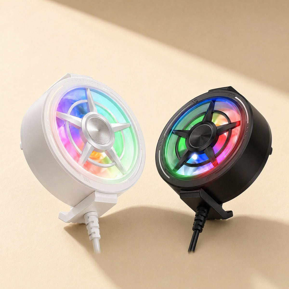 Breezefan Mobile Phone Cooler Fan in white and black, both with rainbow LED lighting, on a beige surface