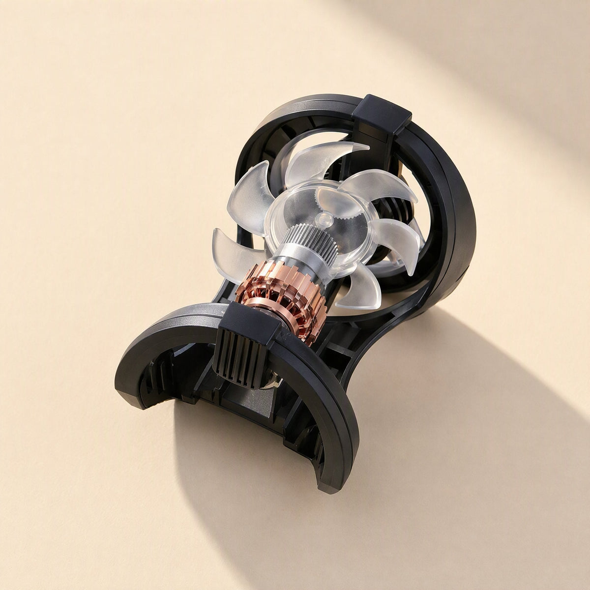 Breezefan – Disassembled cooler fan showing clear translucent blades, copper motor and black clip housing