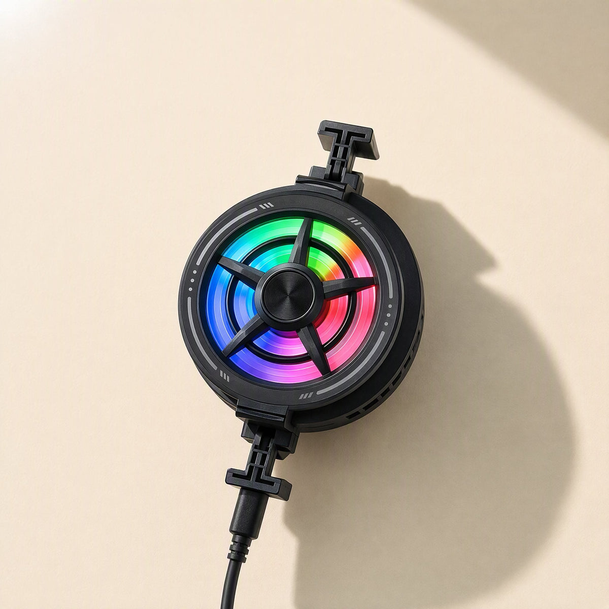 Breezefan – Black cooler fan seen from the back, with clip arms at top and bottom and a cable at the base