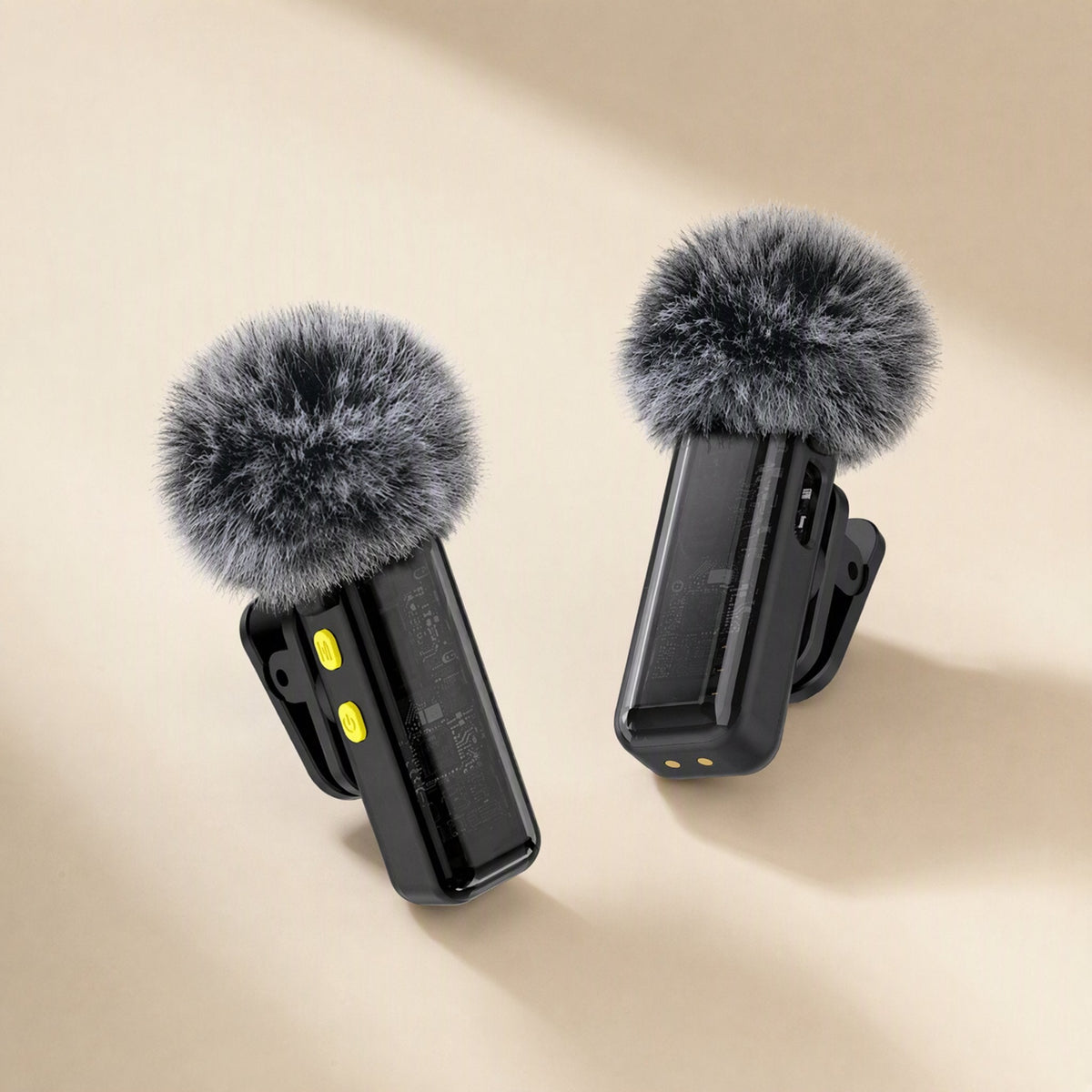 Clipcast – Two black clip-on mics with fluffy windscreens and yellow buttons, shown from front and back