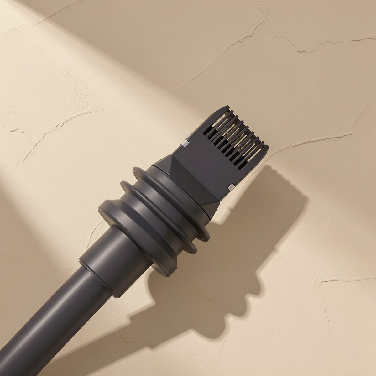 Databraid – Close-up of a black RJ-45 connector with ribbed strain relief and visible contact pins on a beige surface