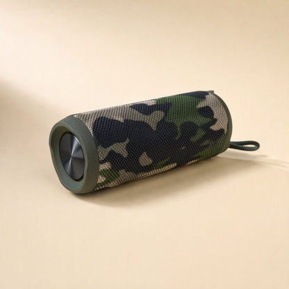 Splashbeat – Camouflage-print cylindrical speaker lying on its side with a fabric loop and visible speaker driver