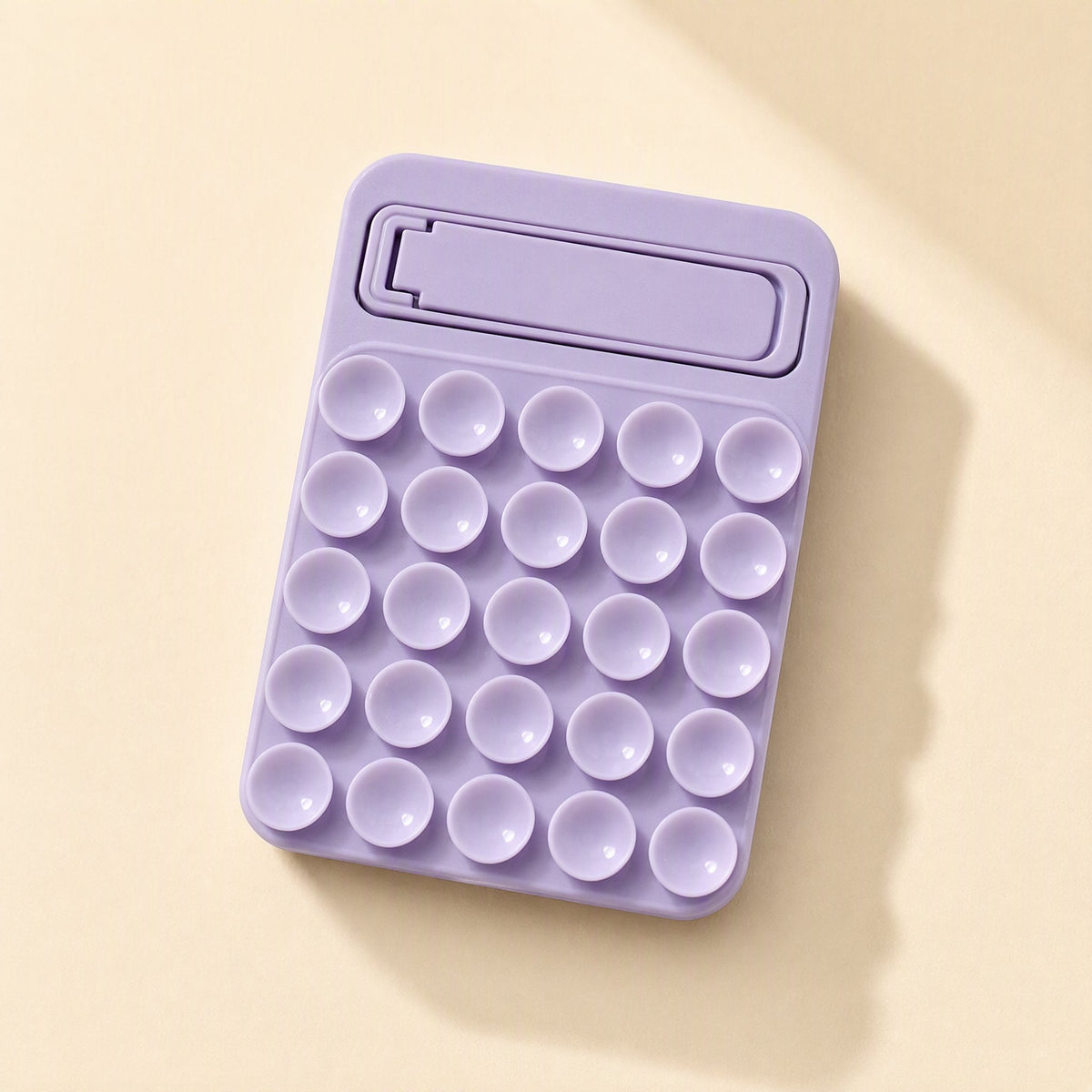 Suctionnest – Purple silicone suction cup phone holder, front view with fold-out kickstand at the top