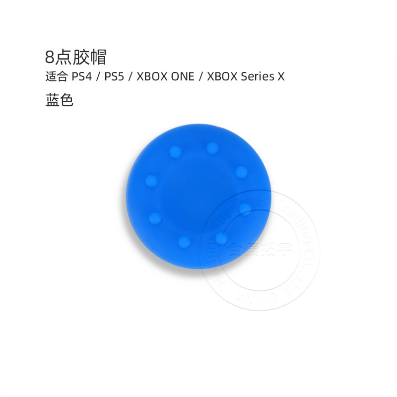 Tapshield – Blue silicone thumbstick cap with eight raised dots around the edge, shown from above on a plain background