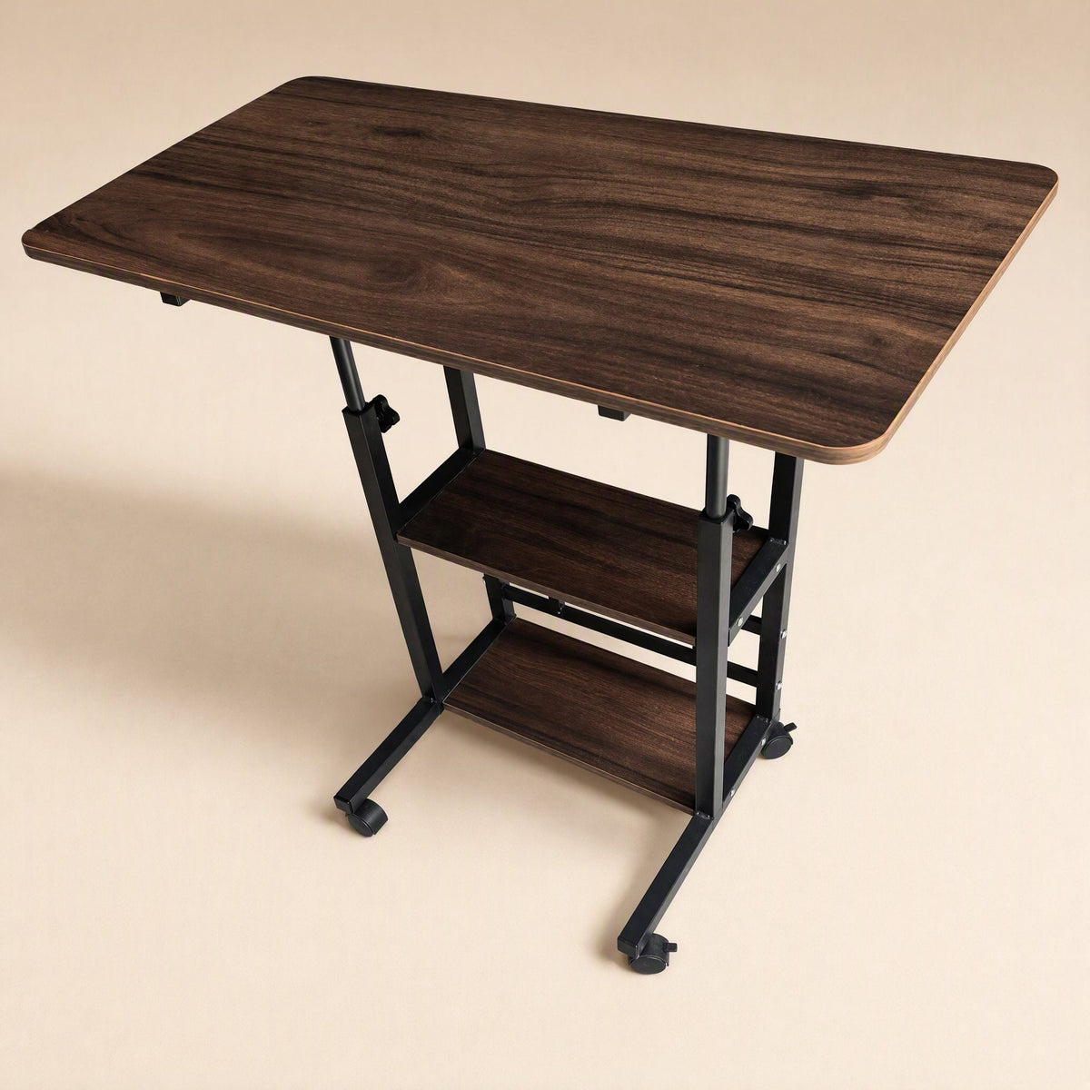 Rollrise – Dark walnut desk with black frame and two lower shelves, seen from above on a beige background