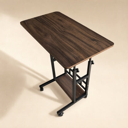 Rollrise – Walnut wood-grain desktop with black frame, casters and one shelf, shown from a high angle with soft shadow