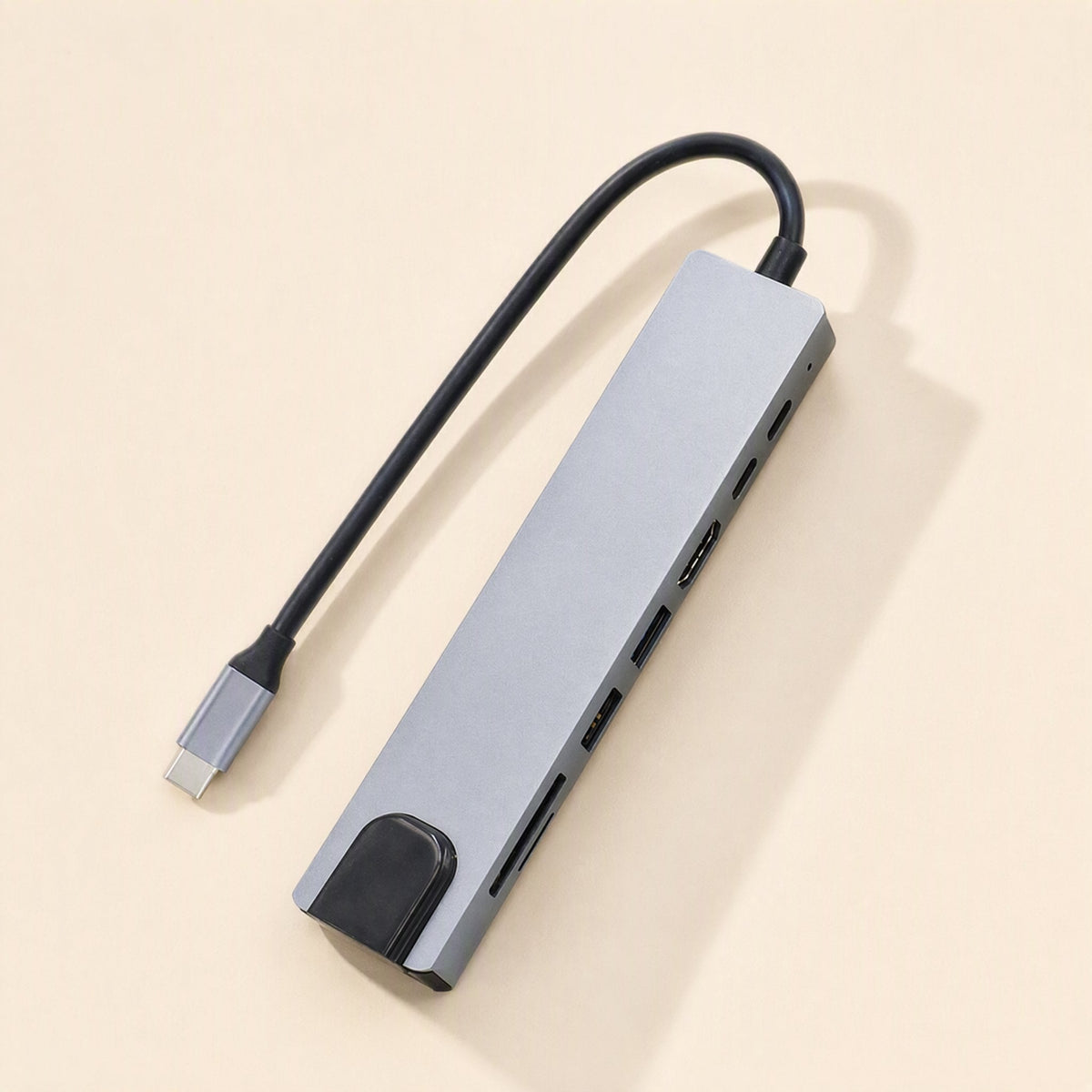 Portspan – Top-down view of the aluminum docking station with its attached USB-C cable curving above it