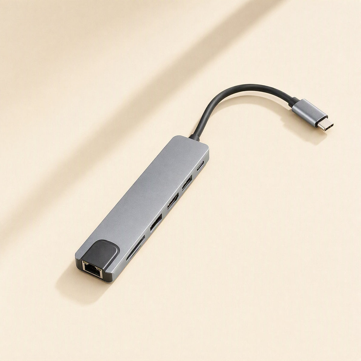 Portspan – Slim gray hub lying flat showing the Ethernet port, card slots, two USB ports and a USB-C port