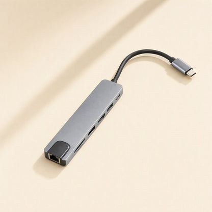 Portspan – Slim gray hub lying flat showing the Ethernet port, card slots, two USB ports and a USB-C port
