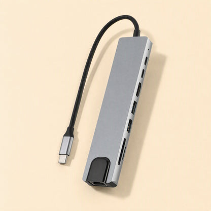 Portspan – Angled view of the gray aluminum hub showing HDMI, USB-A, USB-C and card reader ports along its side