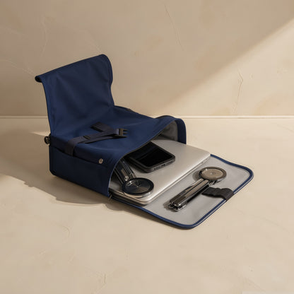 Alufold – Navy canvas bag open to show a laptop, phone and two folded silver stands tucked inside