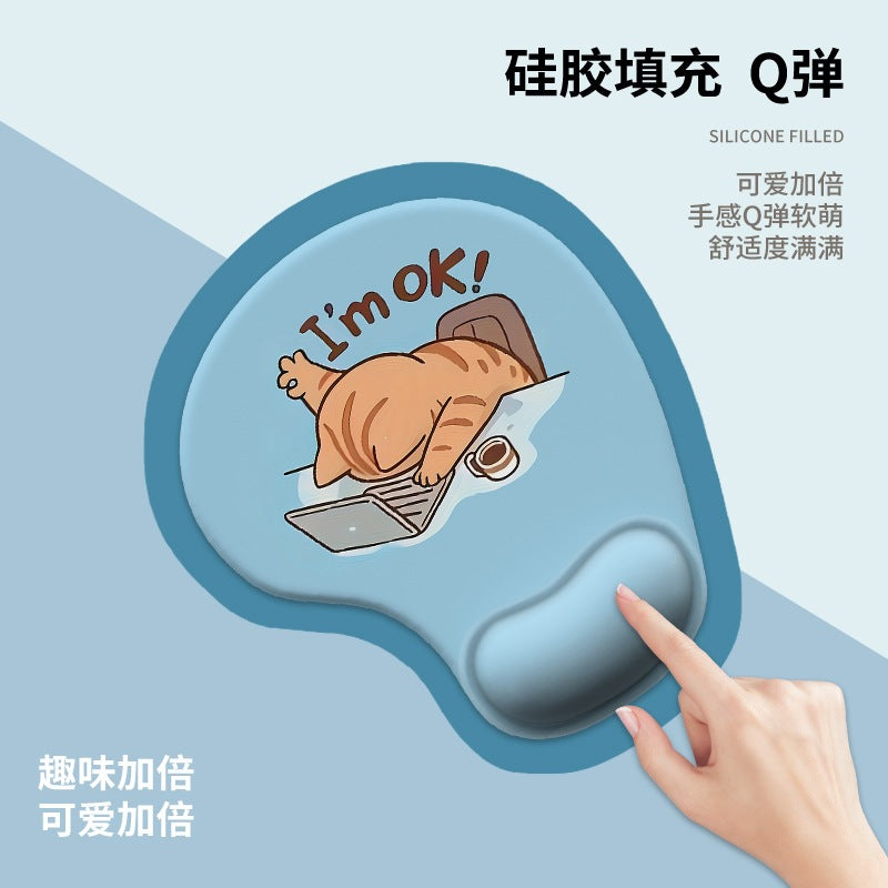 Pawrest – Blue silicone wrist rest pad with an orange cat typing on a laptop, a hand pressing the gel cushion